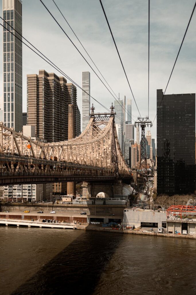 Stunning view of the Queensboro Bridge with Manhattan skyline, an iconic piece of NYC architecture.