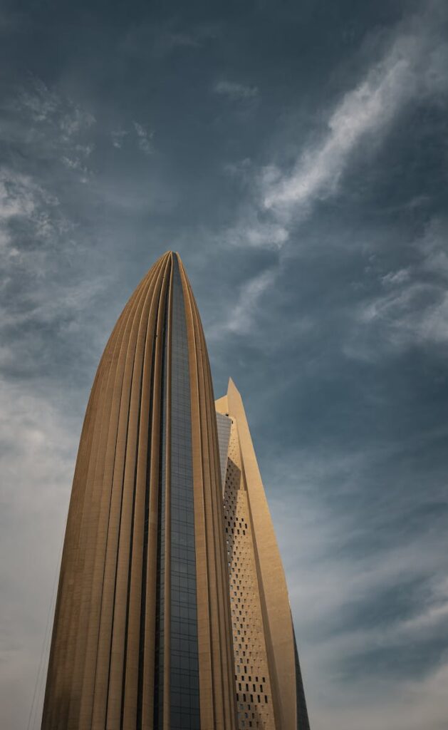 Striking skyscraper architecture reaching towards a dramatic sky in Kuwait City, Kuwait.